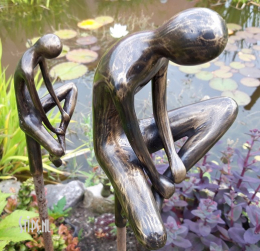 mannenfiguur op staaf in brons